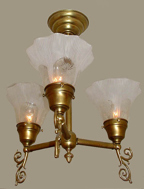 Model H18 An Olde Electric Short Chandelier Reproduction in Antique Brass.